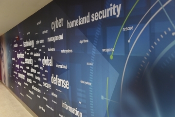 Decorated Wall with keywords related to cybersecurity