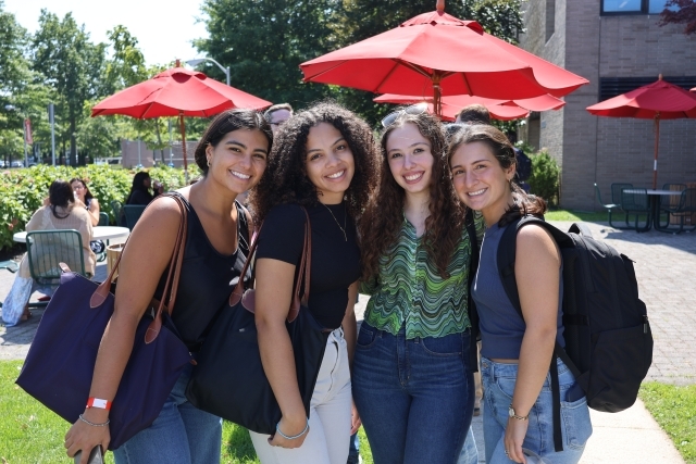 Four students outside of the law school.