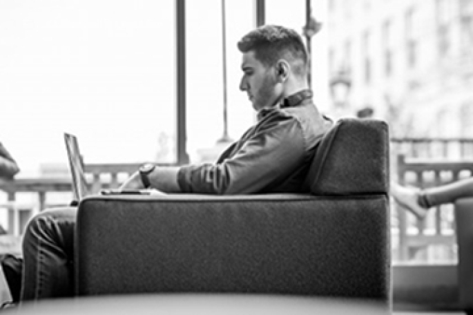 Graduate Student Working on Laptop