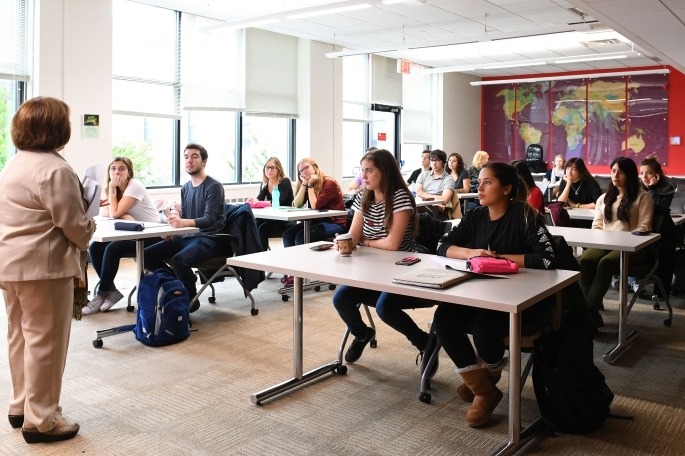 Professor teaching in front of classroom