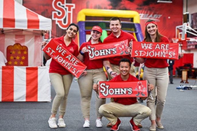 Students Holding We Are St. John's Signs