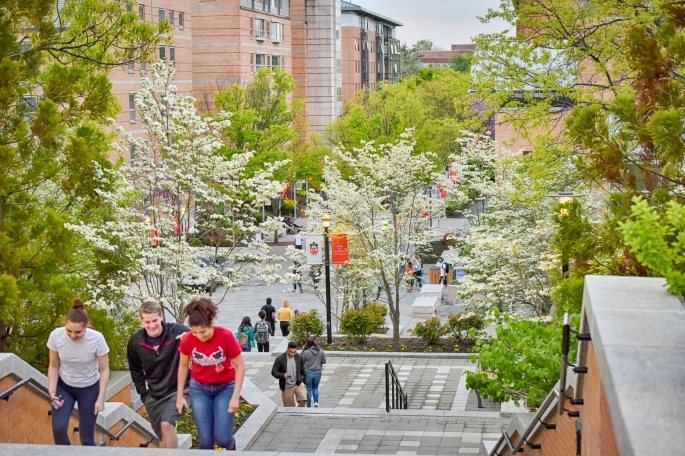 St. John's University students walk through Residence Village on Queens campus