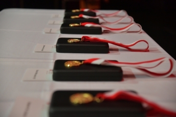 St. John's Law Belson medals set out on a table