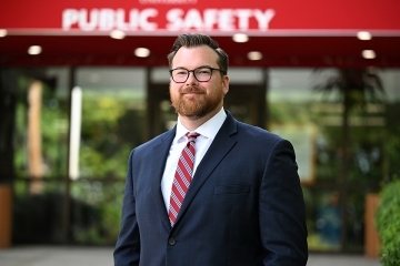 Dan Rhone in front of Public Safety office