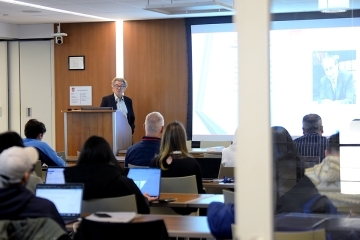 Willi Semmler, Ph.D., Arnhold Professor of International Cooperation and Development (Emeritus) at The New School for Social Research in Manhattan, NY, speaking to a classroom of students