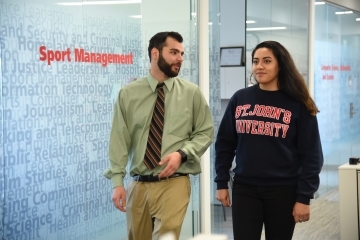 St. John’s Master’s Program in Sport Management Student walking with faculty