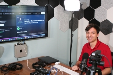 Male student in the St. John's University's new podcast room