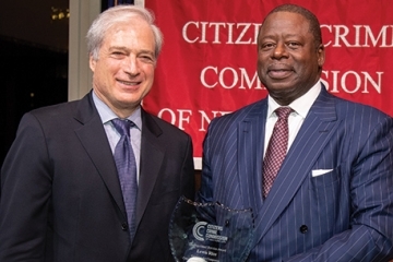 Richard Aborn, President, Citizens Crime Commission of New York City presents the Distinguished Service Award to Lewis Rice, Jr.