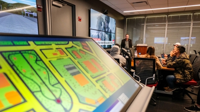 Professor speaking to class in Cyber Security lab