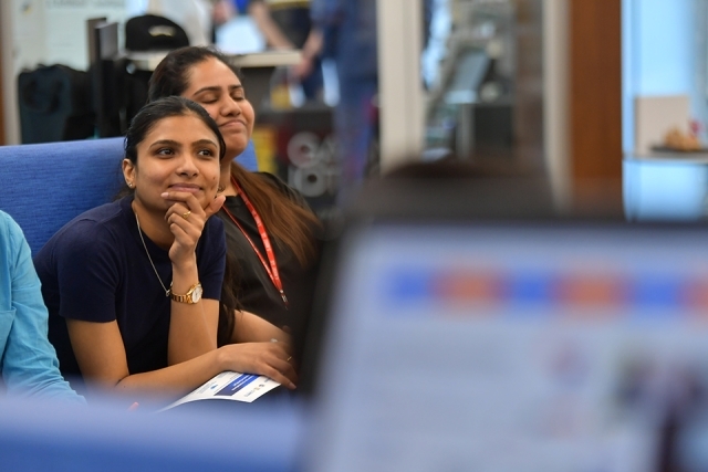 St. John's student watching presentation in Venture Innovation Center presentation