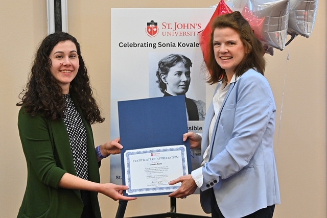 keynote speaker receiving award at Sonia Kovalensky Day