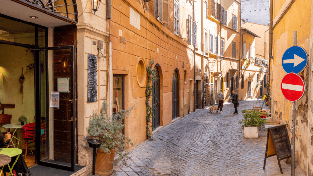 Narrow Street with Cafe and Small Shops in Rome⁠