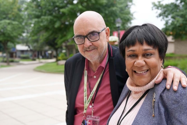 Fr. Rooney and summit attendee pose for a photo