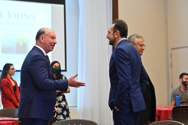 Dean Iandoli speaking with a man