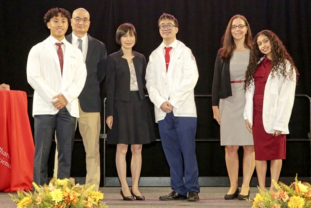 St. John’s University’s College of Pharmacy and Health Sciences received their white coats from Dean Lin