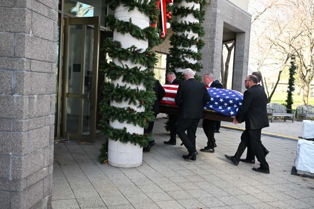 Lou Carnesecca's casket entering St. Thomas More Church lobby 