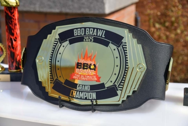 Champion belt with Chartwells’ Blazing BBQ Brawl