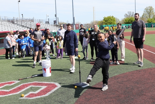 St. John's athletes with special needs students on the lacrosse field