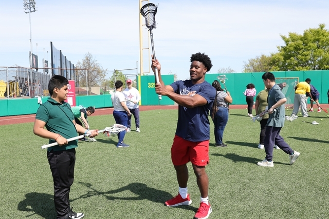 St. John's athletes with special needs students on the lacrosse field