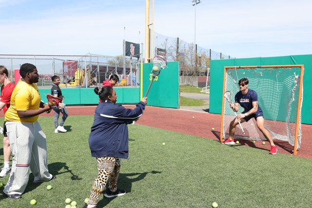 St. John's athletes with special needs students on the lacrosse field