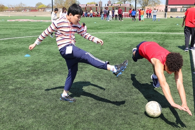Special needs students playing on DaSilva field