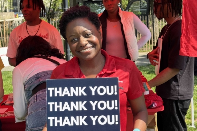 St. John's student holding Thank You signs for their generous donations