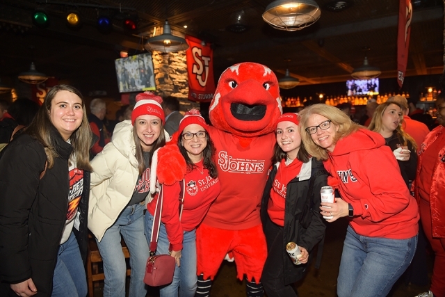 2024-25 Basketball Season Pregame Reception attendees with Johnny Thunderbird