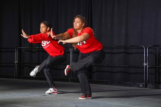 Two St. John's students dancing on stage