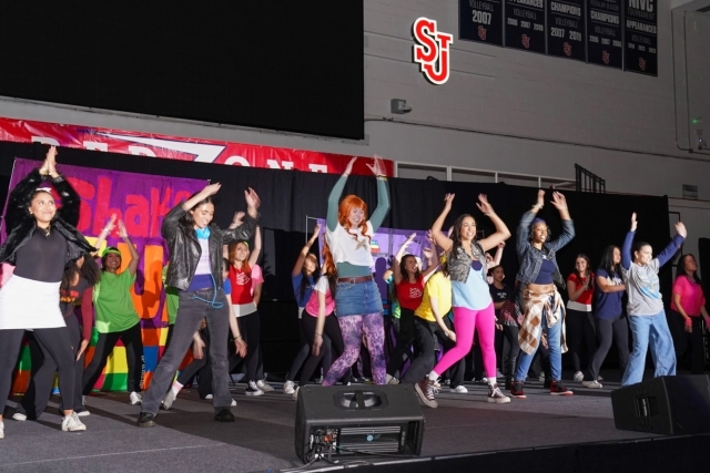 St. John's students in costume dancing at an event