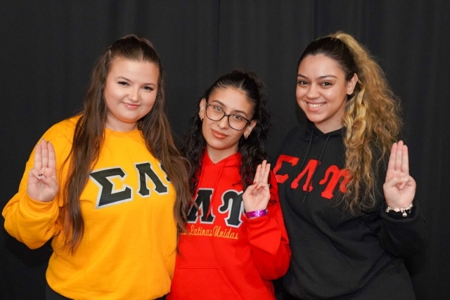 Three St. John's students posing for a photo