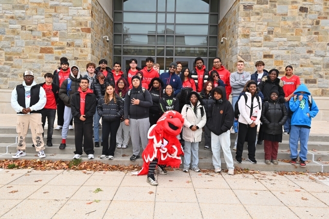 Group of High School Students in Front of DAC building with Johnny Thunderbird