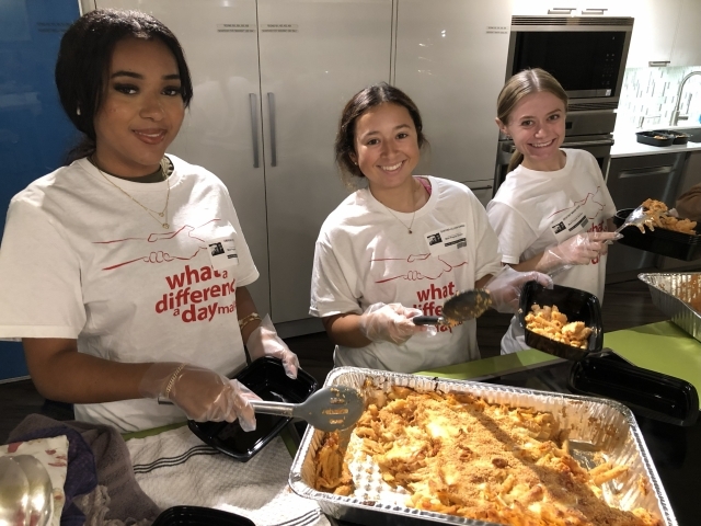 Three students making food at Ronald McDonald House