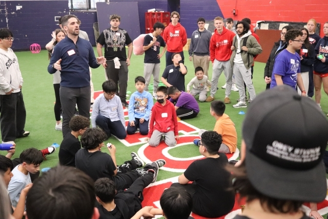 Grade School Children in Gym with Director of CEL