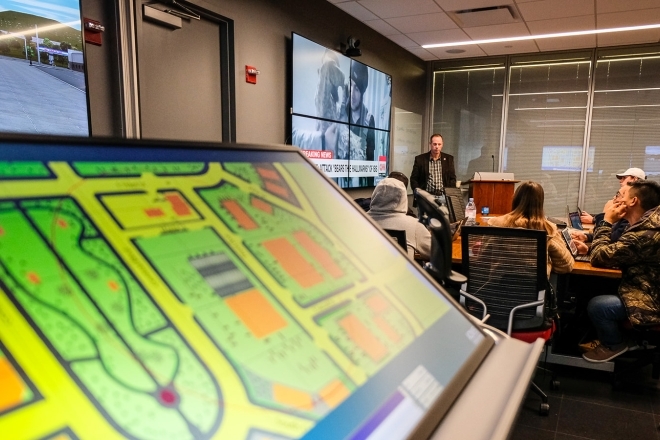 Professor speaking to class in Cyber Security lab