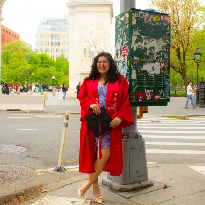 St. john's university student in a red cap and gown