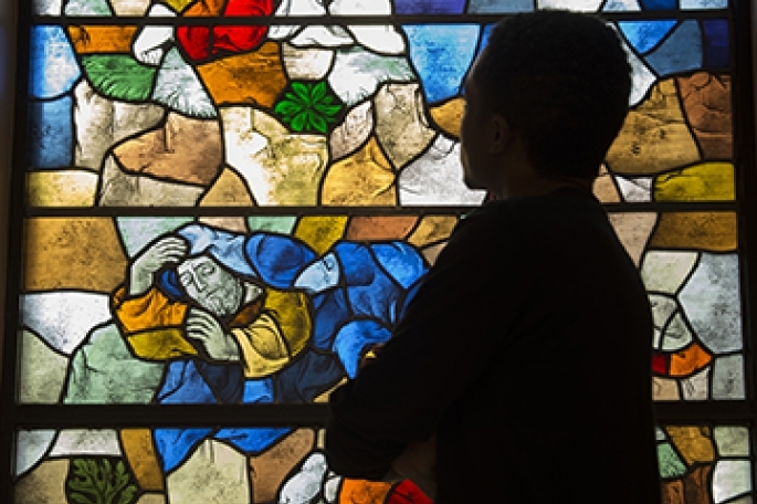 student infront of stain glass window