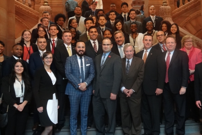 Group of alumni and students on steps of capital building
