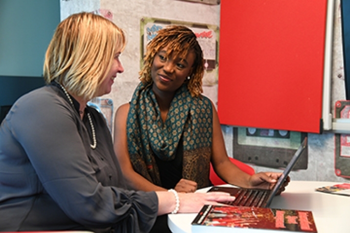 Female faculty member with female student