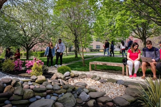 Students talking and walking together on campus