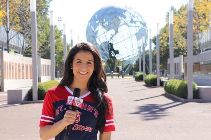 Kristen holding mic outside tennis center