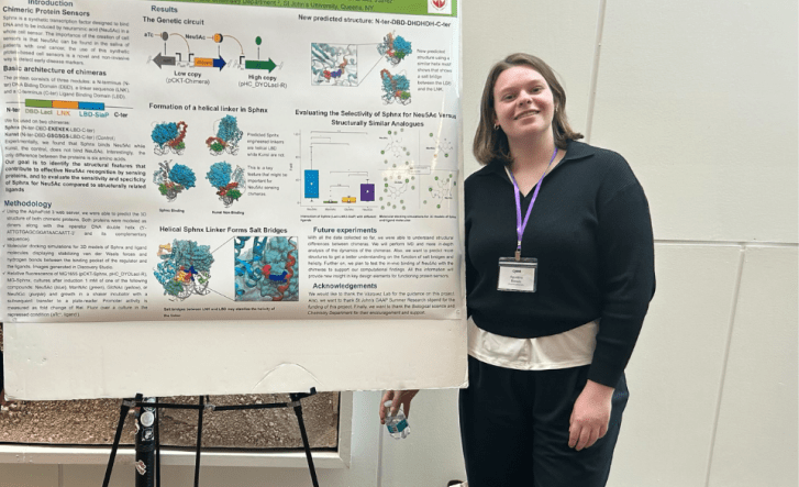 Student in front of a presentation board
