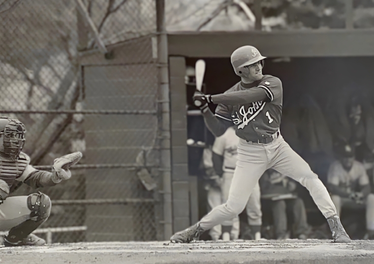 black and white photo of Rich Aurilia batting in his St. John's uniform