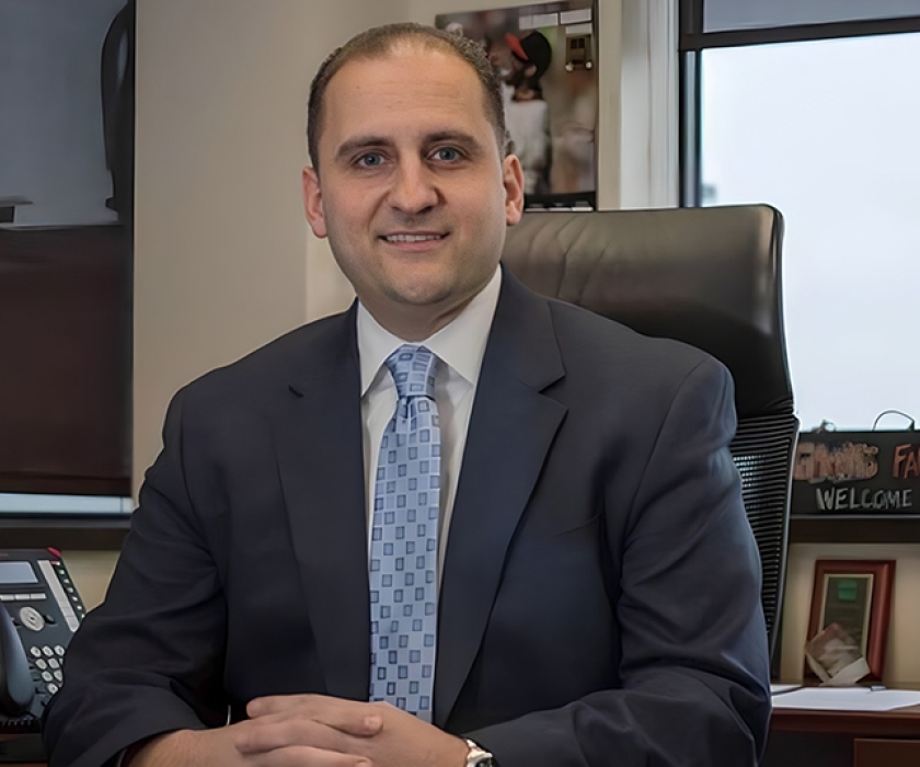 Peter Setaro, St. John's Alumni, sitting at his desk